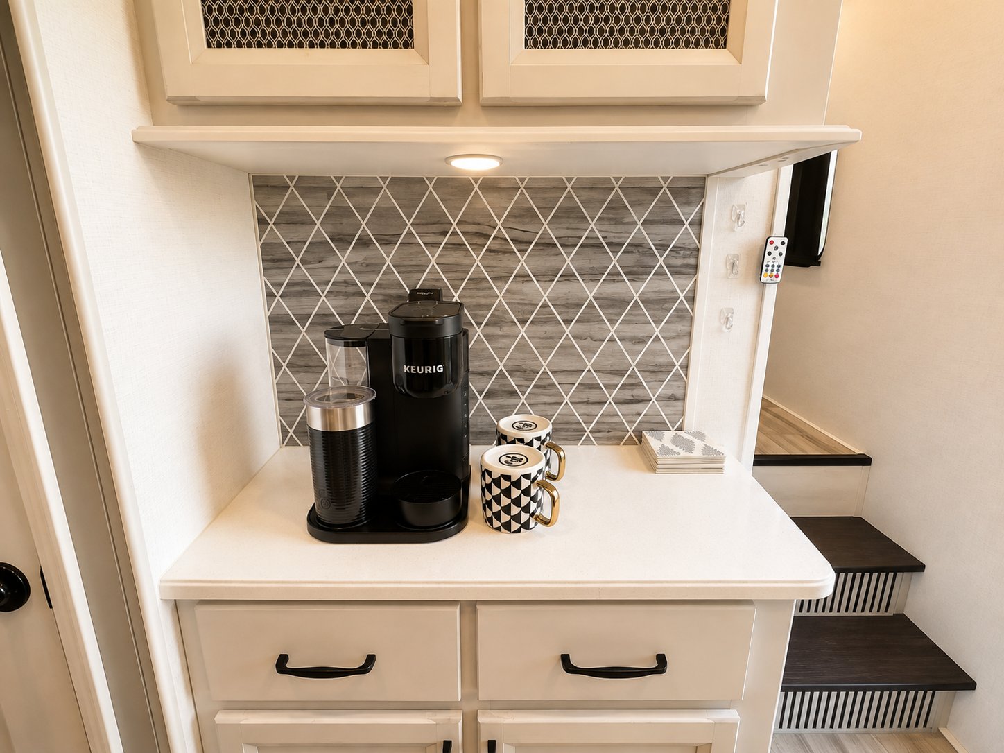 Coffee bar with Keurig, mugs, and tea service