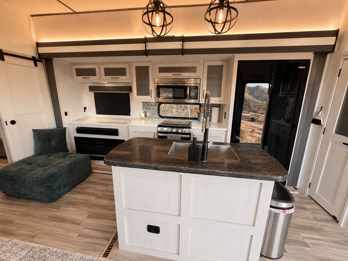 Kitchen island with view through to the indoor fireplace