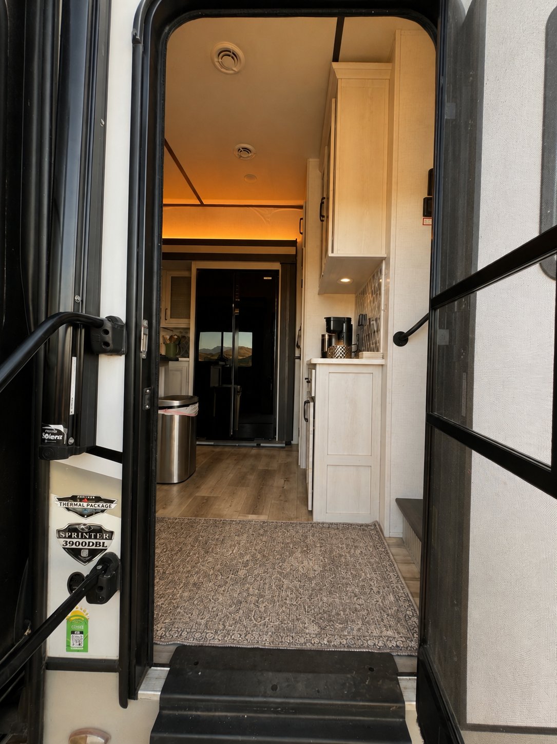View through the open main entrance toward the kitchen
